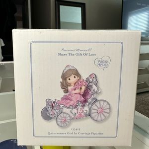 Precious Moments quinceañera girl in a carriage figurine